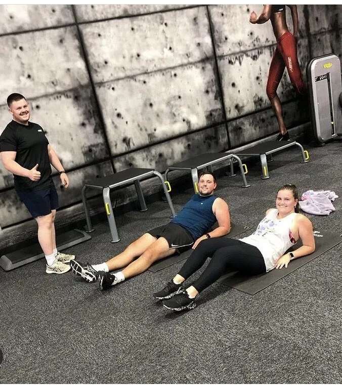 Charlie Johns coaching a small group through a supervised strength session at Phenom Gym in Cork, the steady, moderate style of training recommended for people managing arthritis
